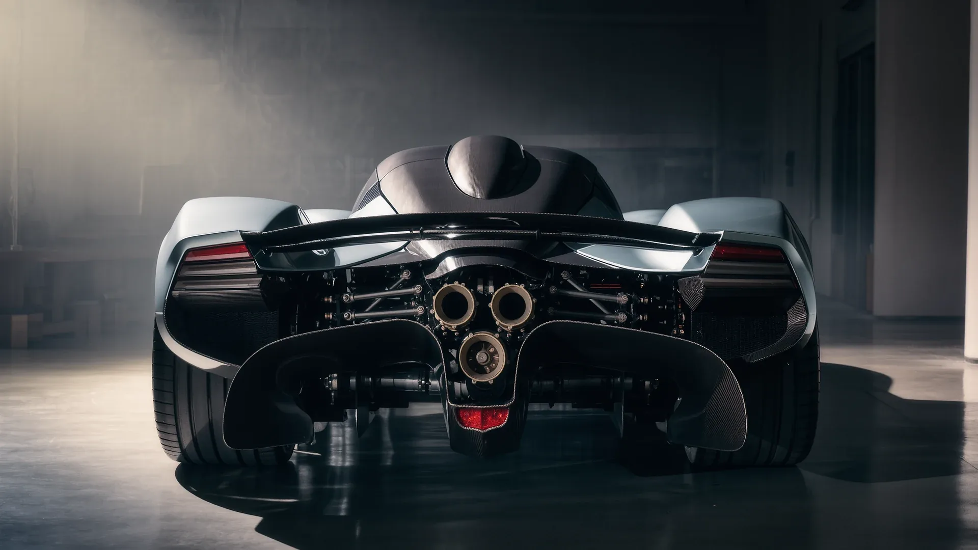Rear view of a supercar showing the exhaust outlets and diffuser