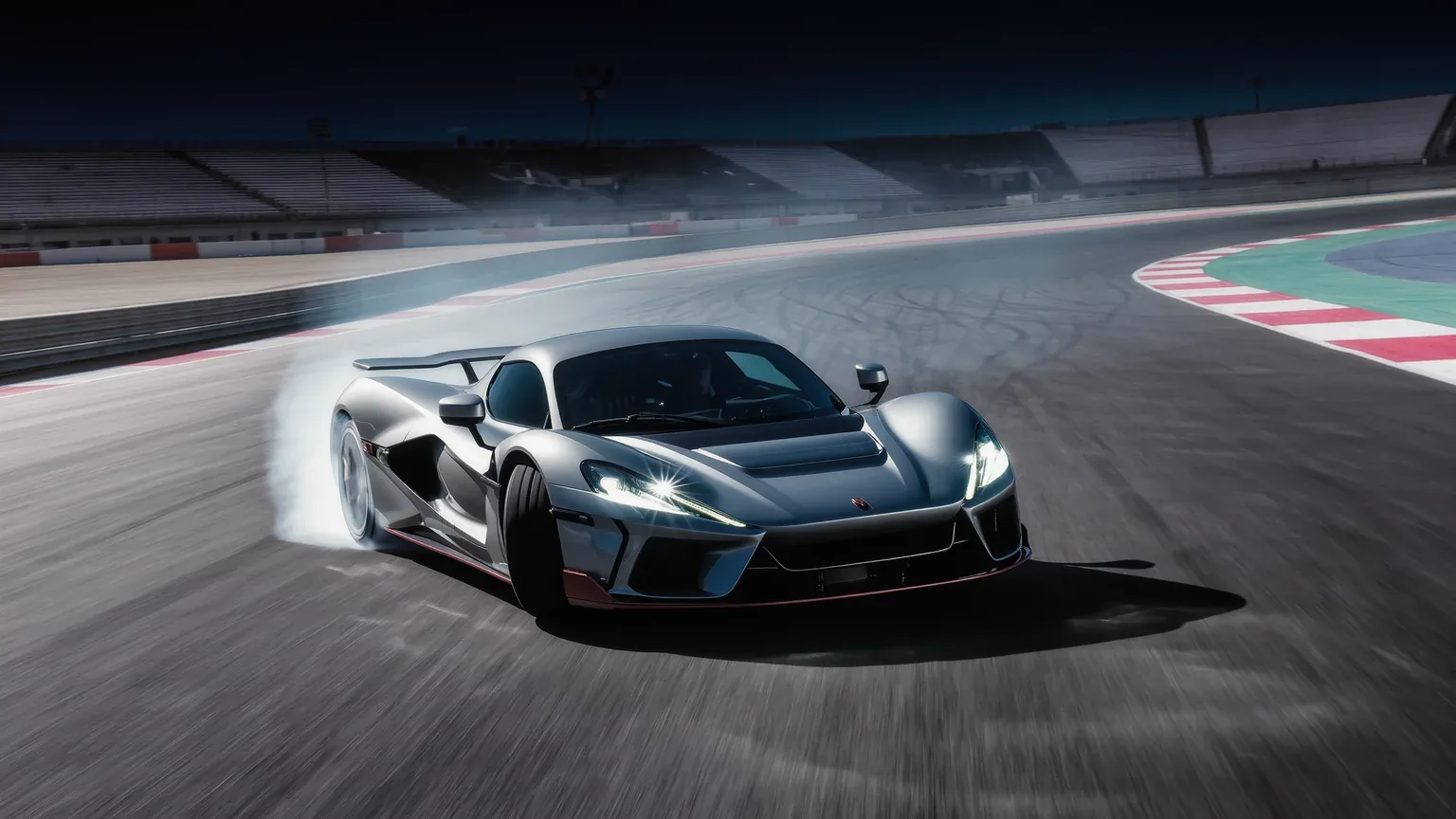 A supercar sliding through a circuit corner with the kerbs visible